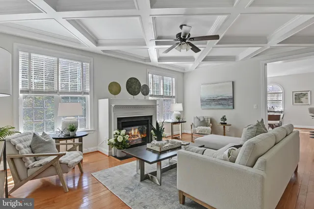 a view of staircase with railing and a chandelier