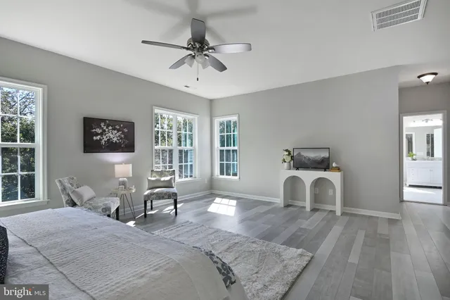a view of a livingroom with a dishwasher and wooden floor