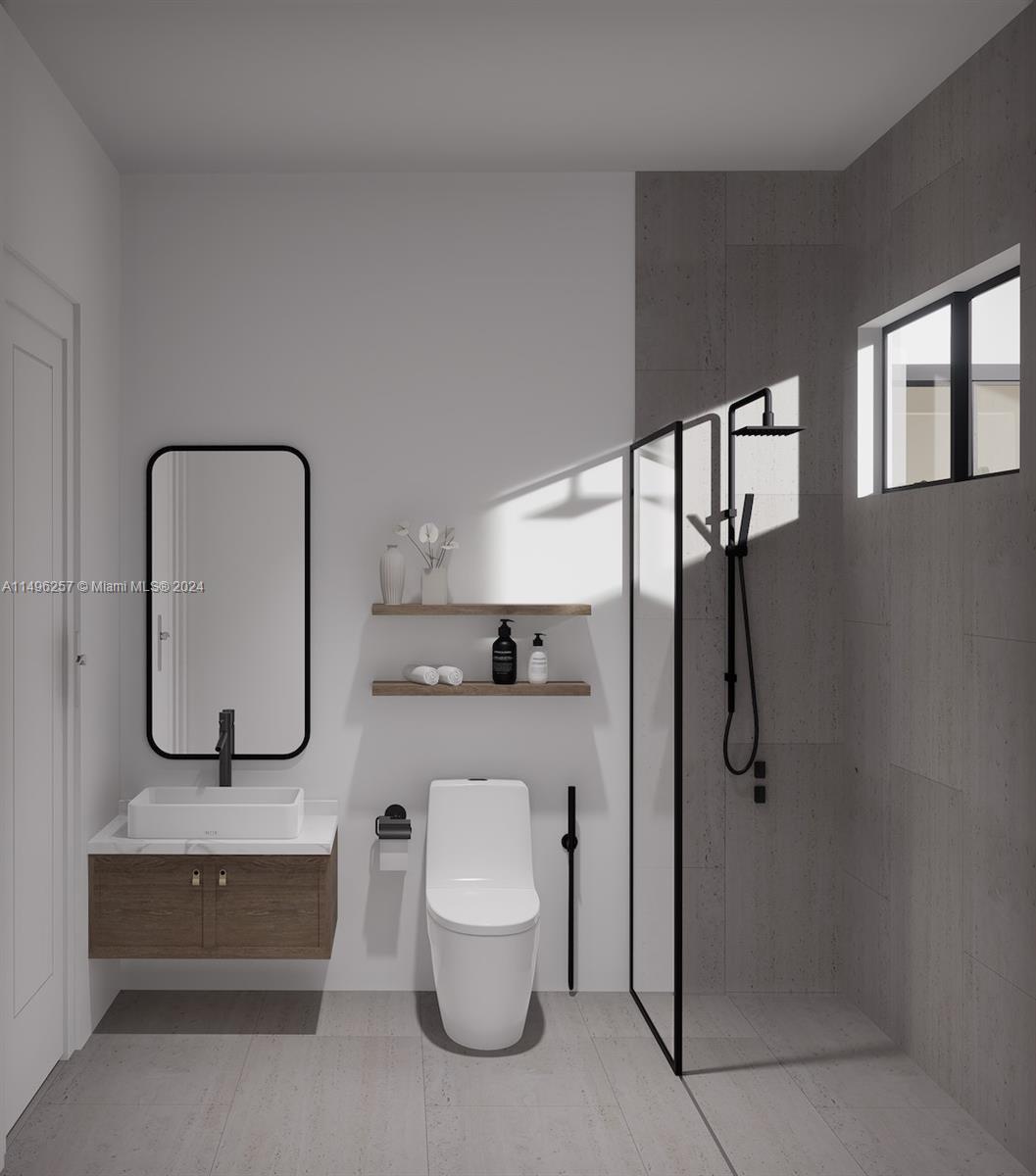 311 Southwest 21st Road Miami, FL 33129 - Photo 9 of 11 a bathroom with a toilet and a sink