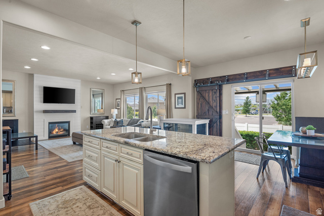 955 Delorean Lane Midvale, UT 84047 - Photo 9 of 47 Kitchen island with granite countertop and double stainless steel sink