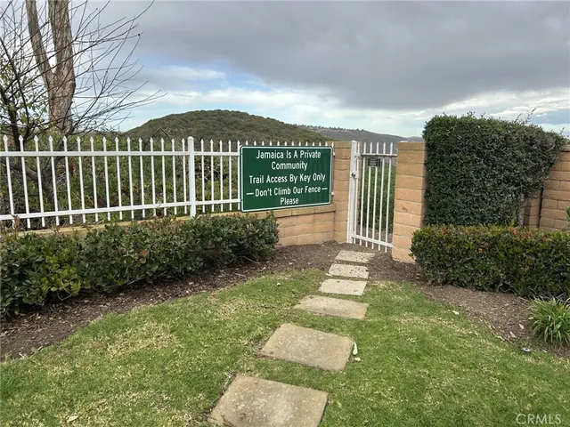 a kitchen with kitchen island granite countertop counter top space a sink and stainless steel appliances