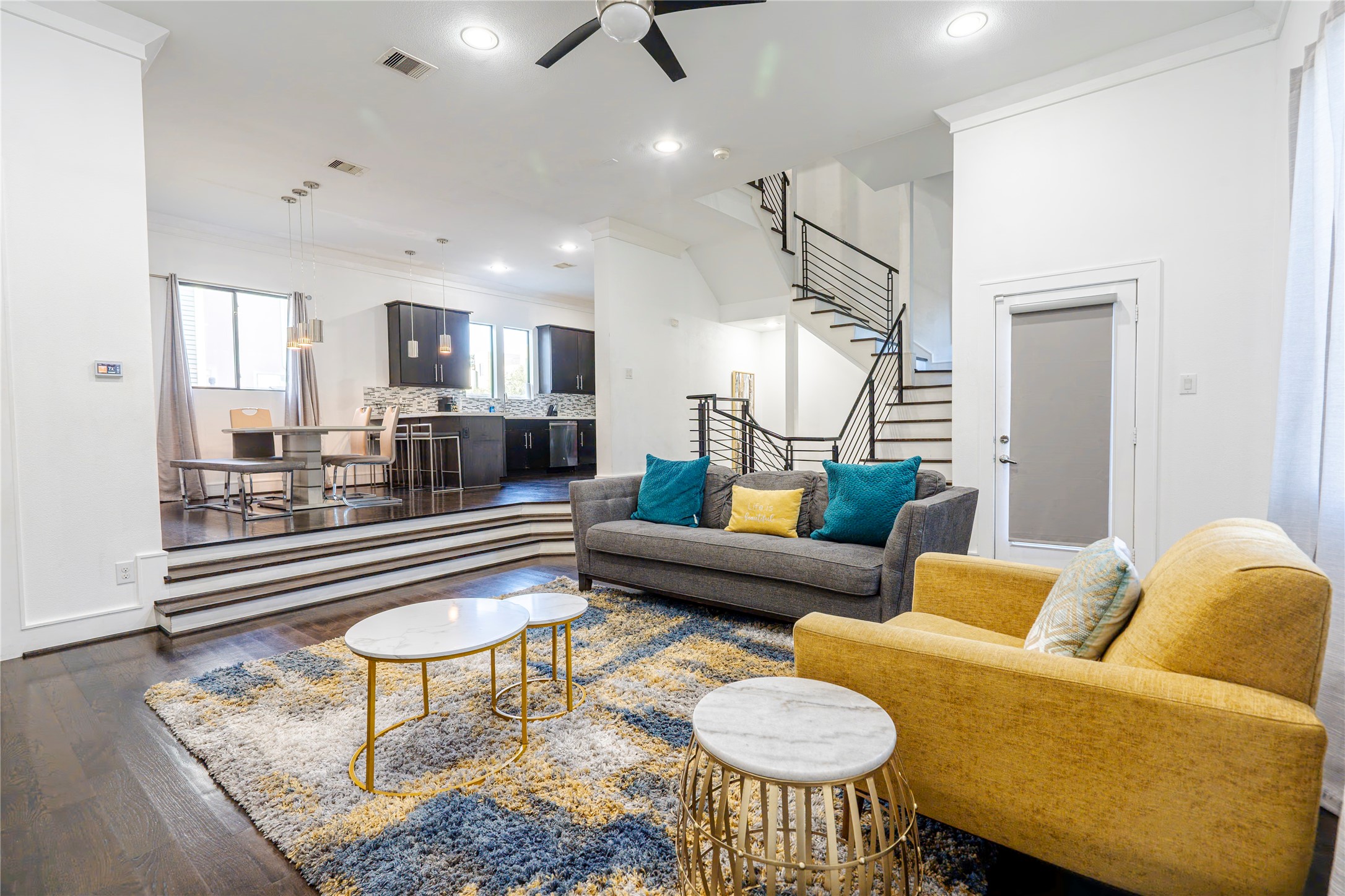 a living room with furniture and a table