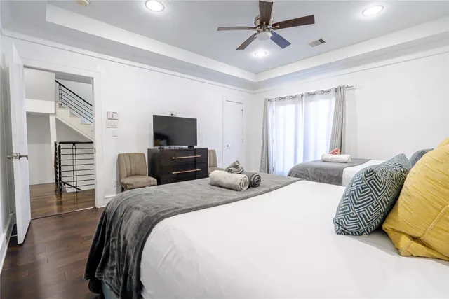 a bedroom with a bed and tv