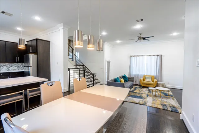 a living room with fireplace furniture and a wooden floor