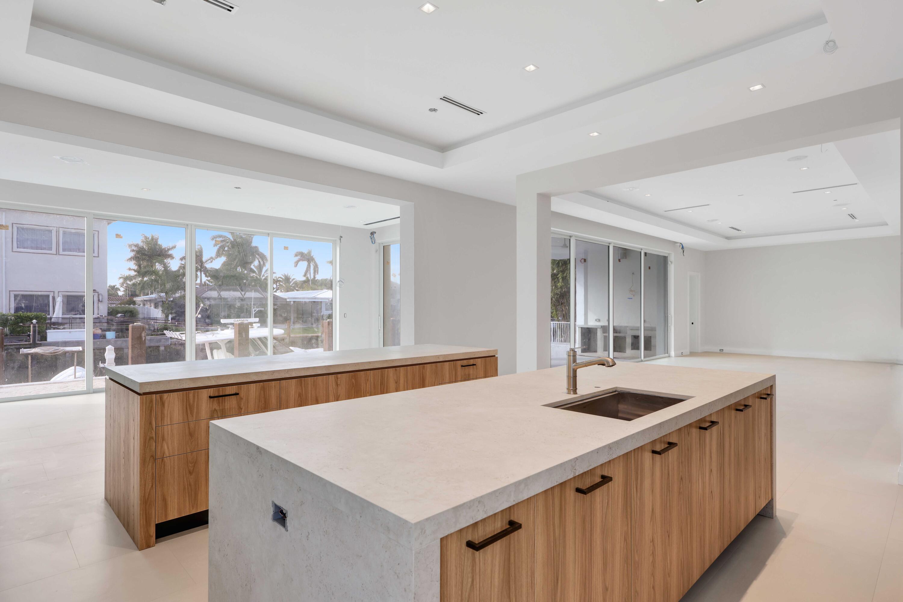 810 Northeast 70th Street Boca Raton, FL 33487 - Photo 11 of 32 a kitchen that has a sink and a large window