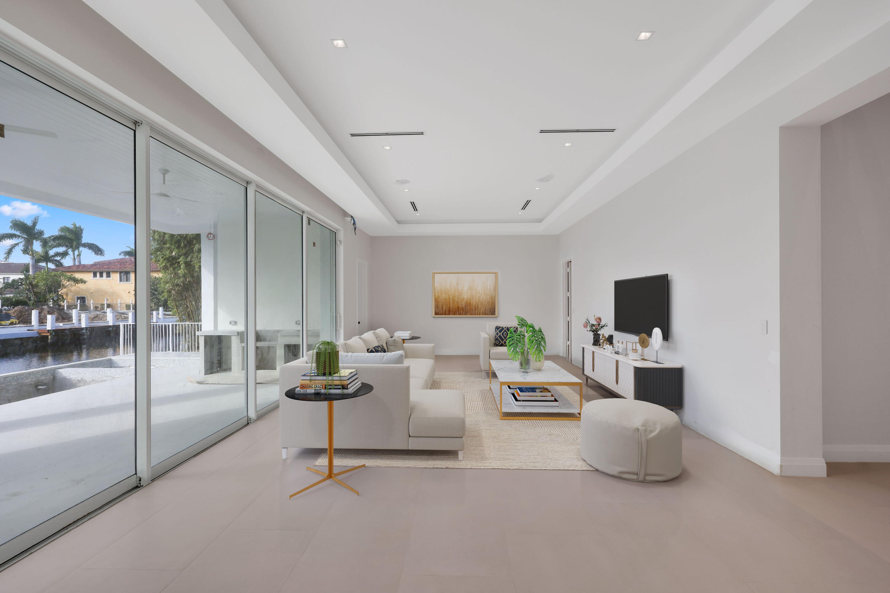 810 Northeast 70th Street Boca Raton, FL 33487 - Photo 12 of 32 a living room with furniture and a flat screen tv