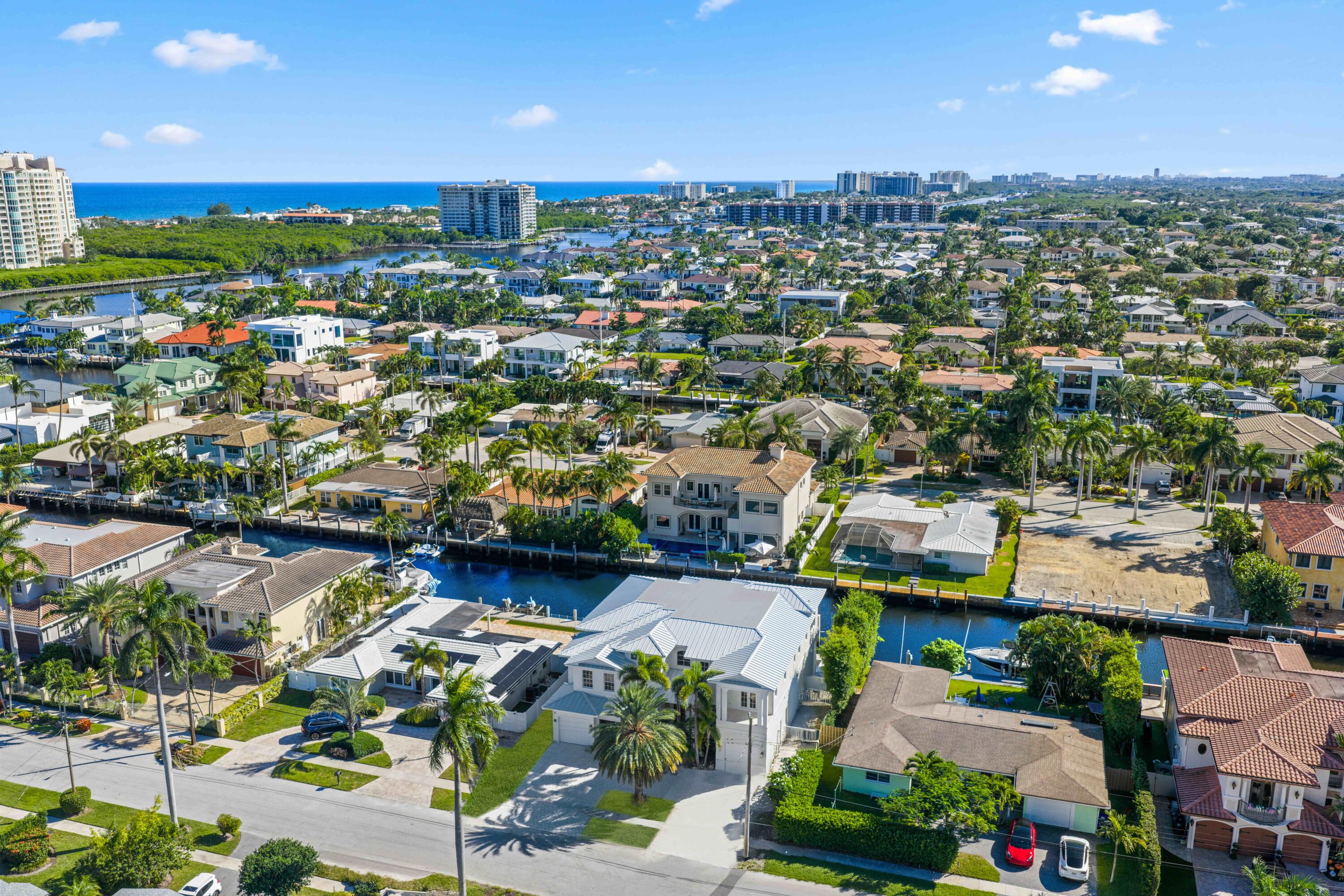 810 Northeast 70th Street Boca Raton, FL 33487 - Photo 4 of 32 an aerial view of residential houses with outdoor space and parking