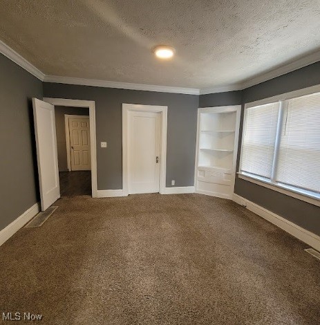 18225 Landseer Road Cleveland, OH 44119 - Photo 10 of 12 Unfurnished bedroom featuring carpet flooring, a textured ceiling, and crown molding