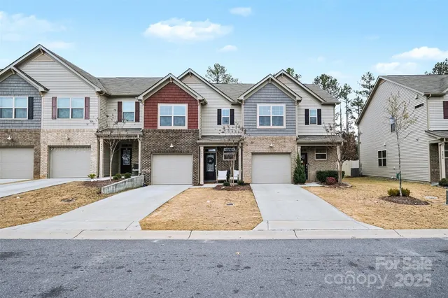 a bathroom with a granite countertop sink mirror vanity and toilet