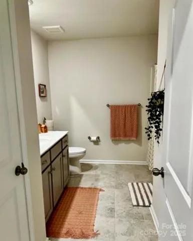 a view of kitchen with stainless steel appliances granite countertop a stove a sink and a refrigerator