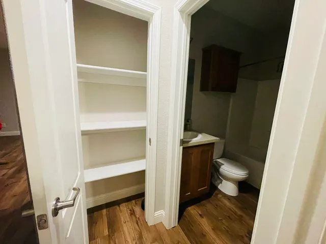a bathroom with a toilet and a sink