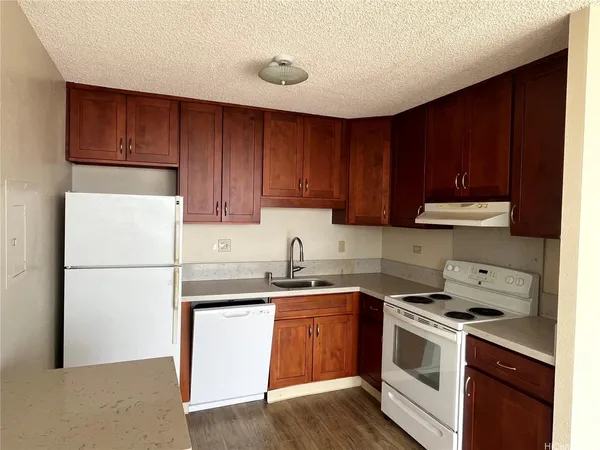a kitchen with a white cabinets and white appliances