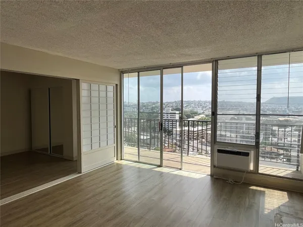 wooden floor in an empty room with glass door