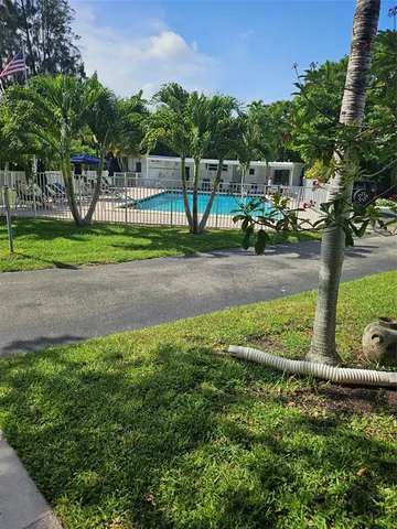 a view of a water fountain in a yard