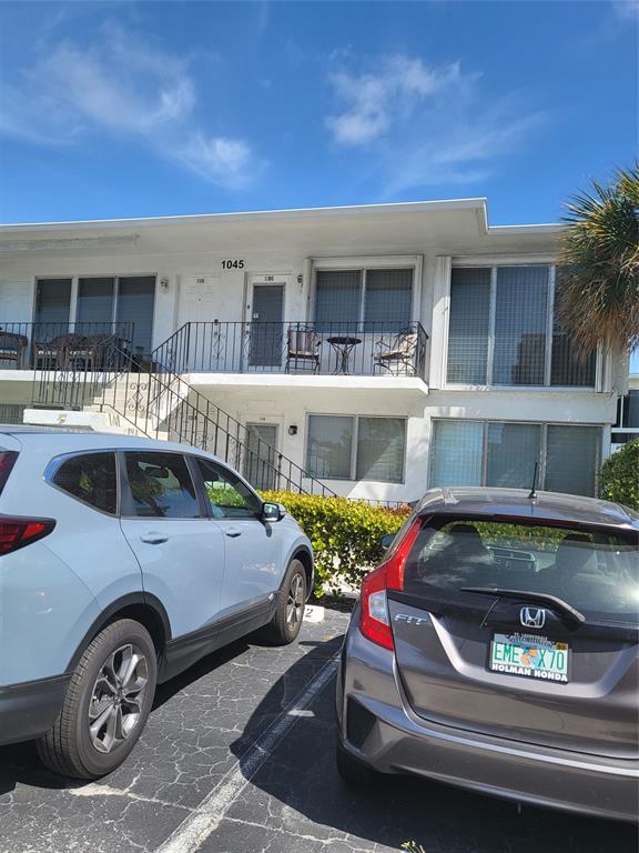 1045 Southeast 15th Street, Unit 13C Fort Lauderdale, FL 33316 - Photo 2 of 20 a front view of a house with parking area