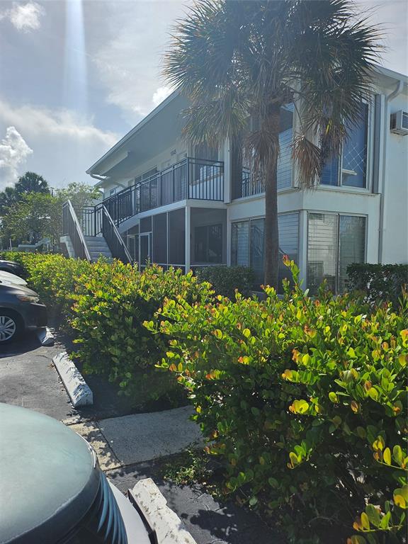 1045 Southeast 15th Street, Unit 13C Fort Lauderdale, FL 33316 - Photo 5 of 20 a view of a house with a flower garden