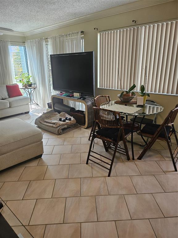 1045 Southeast 15th Street, Unit 13C Fort Lauderdale, FL 33316 - Photo 8 of 20 a living room with furniture and a flat screen tv