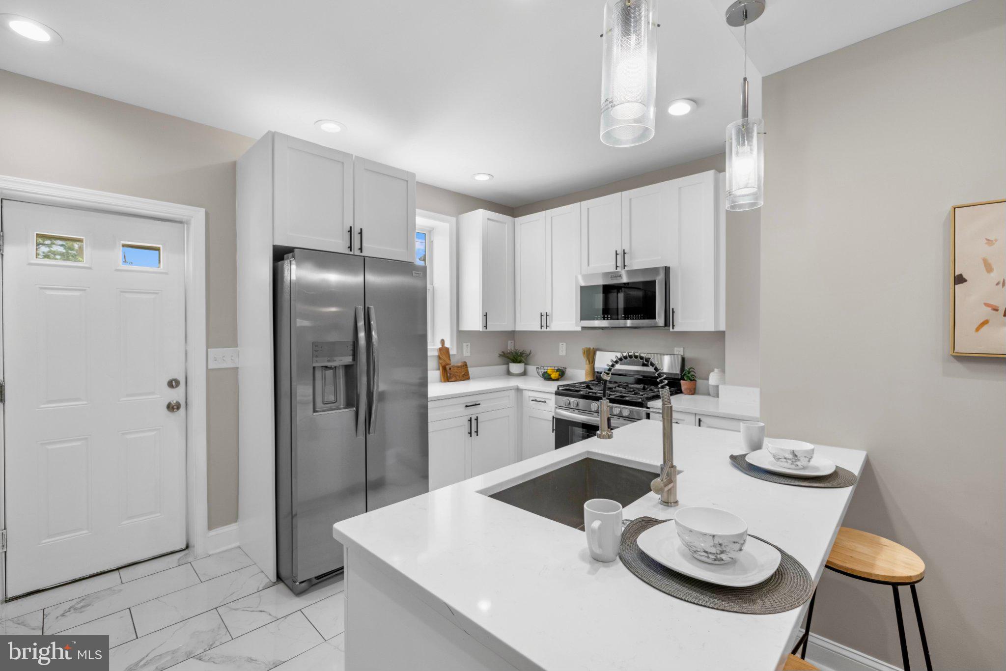 145 North Monastery Avenue Baltimore, MD 21229 - Photo 9 of 45 Modern kitchen with sleek finishes.