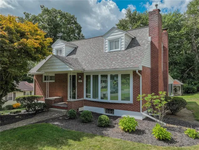 front view of a house with a yard