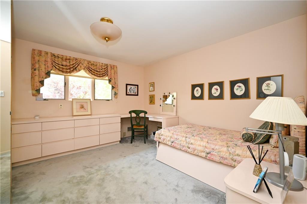 29 Kansas Place Brooklyn, NY 11234 - Photo 11 of 24 a bedroom with a bed and a chandelier