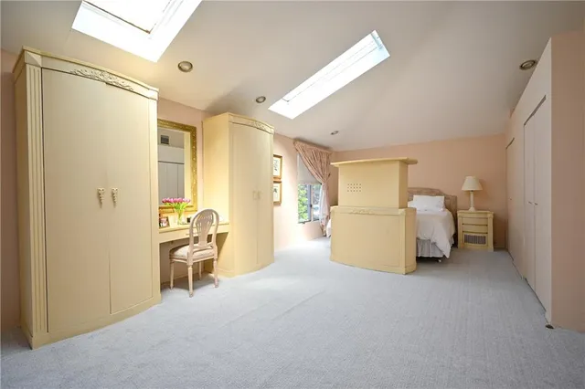 a bedroom with a bed and a chair