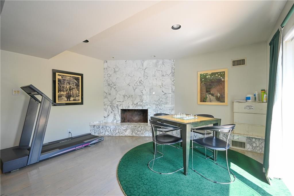 29 Kansas Place Brooklyn, NY 11234 - Photo 16 of 24 a living room with furniture a piano and a fireplace