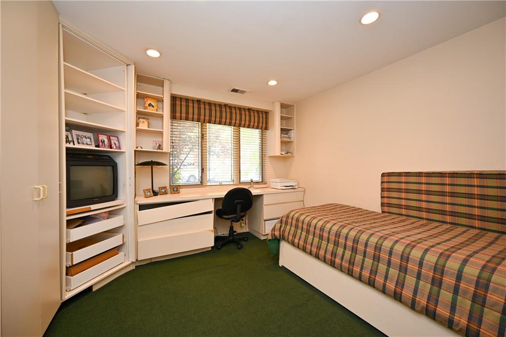 29 Kansas Place Brooklyn, NY 11234 - Photo 19 of 24 a bedroom with a bed and a flat screen tv