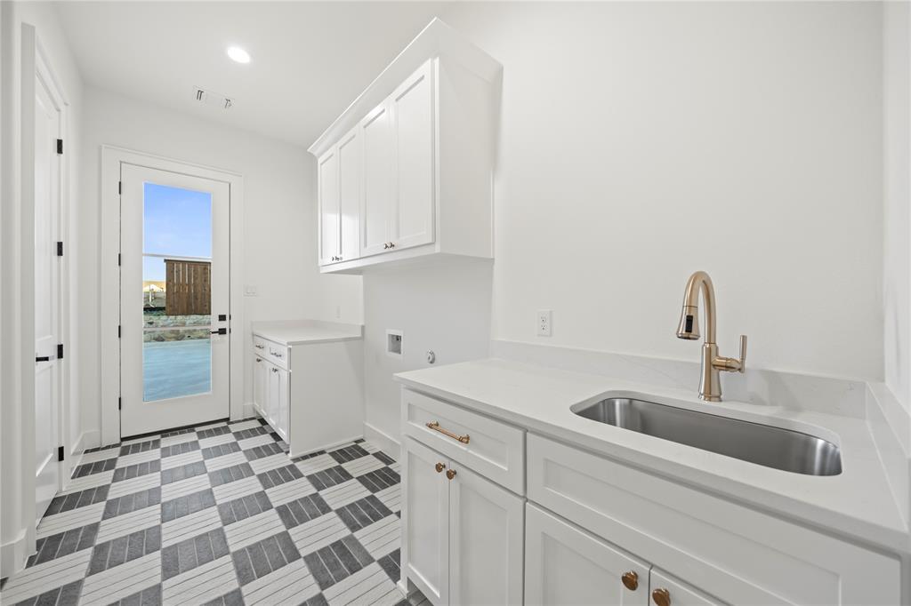 108 Bel Grand Road Haslet, TX 76052 - Photo 14 of 40 Laundry room with cabinet space, washer hookup, recessed lighting, and dark floors
