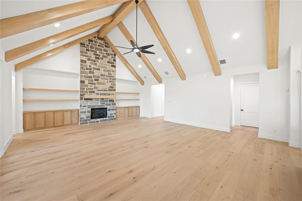 108 Bel Grand Road Haslet, TX 76052 - Photo 17 of 40 Unfurnished living room with recessed lighting, light wood-style floors, a fireplace, and ceiling fan