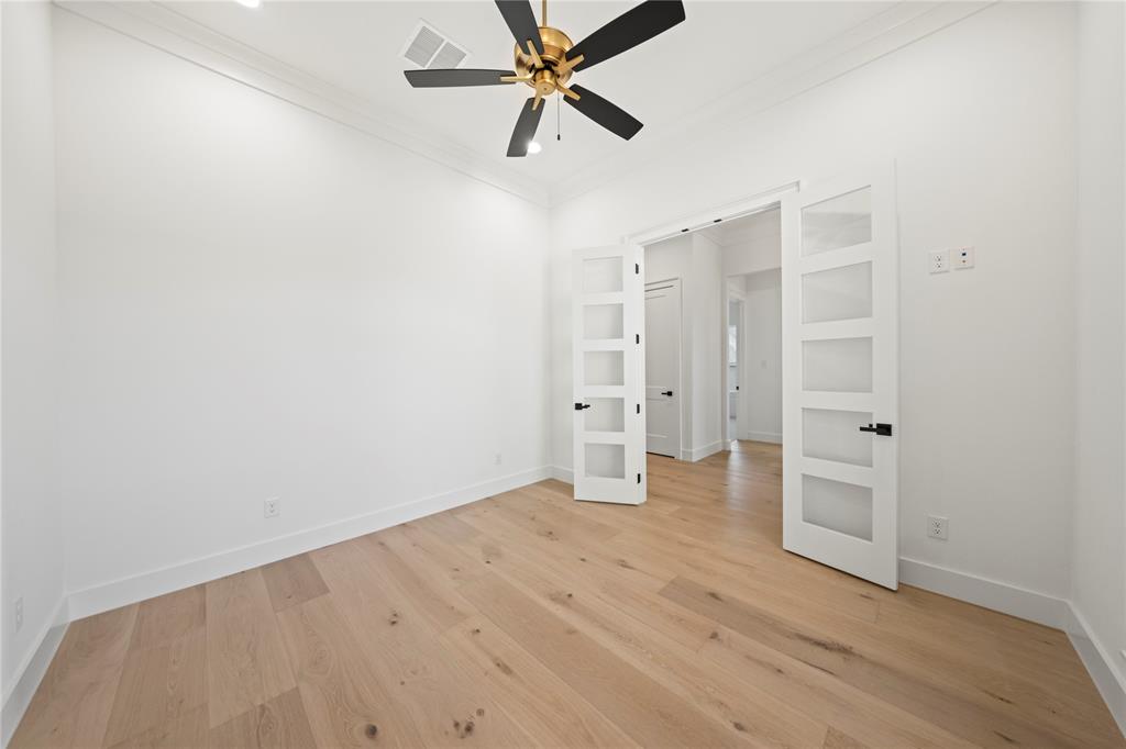 108 Bel Grand Road Haslet, TX 76052 - Photo 7 of 40 Unfurnished bedroom with ornamental molding, light wood-type flooring, and a ceiling fan