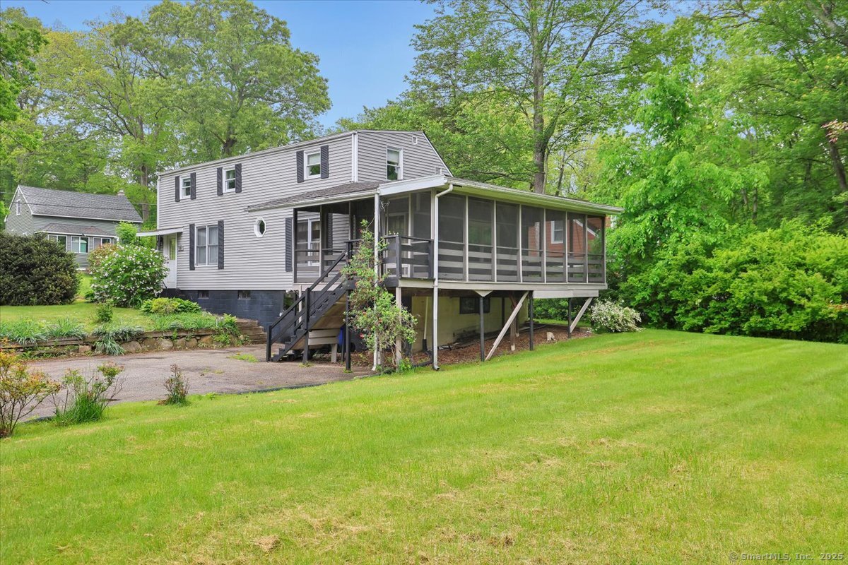 Coventry Lake Home in Waterfront Heights Lake Association with 3 good sized bedrooms, spacious eat in kitchen, living room with wood stove and more!