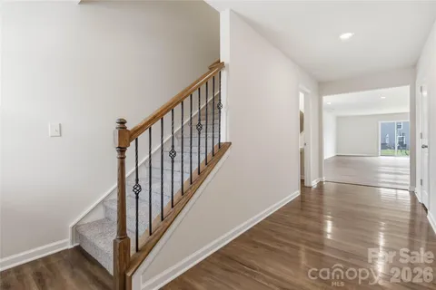 a view of an entryway with wooden floor