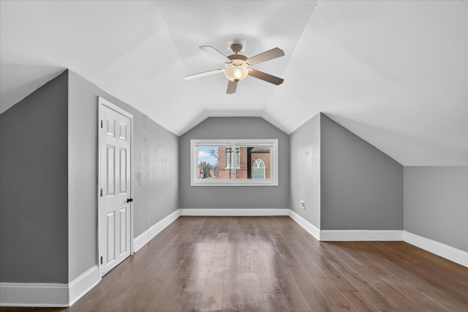 1 East 114th Street Chicago, IL 60628 - Photo 17 of 33 a view of empty room with wooden floor and fan