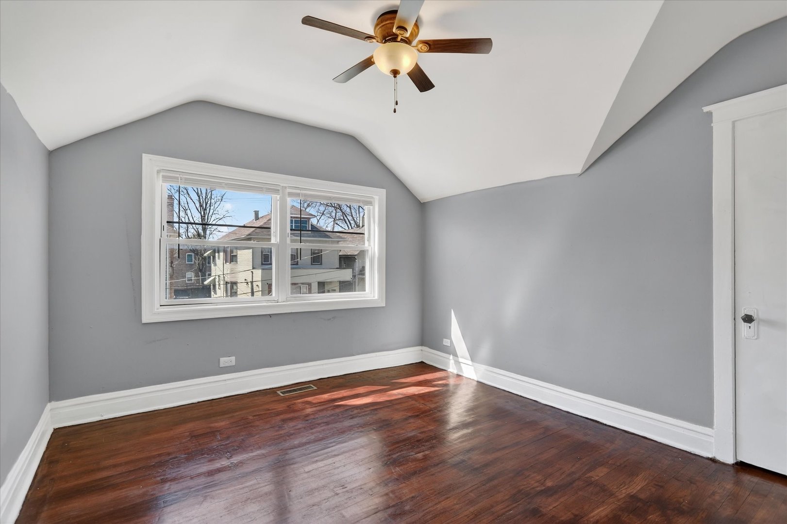 1 East 114th Street Chicago, IL 60628 - Photo 21 of 33 a view of a big room with wooden floor and windows