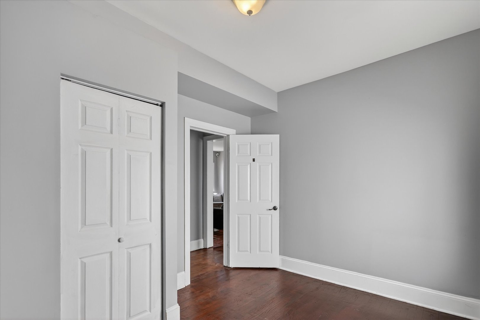 1 East 114th Street Chicago, IL 60628 - Photo 28 of 33 an empty room with wooden floor and windows