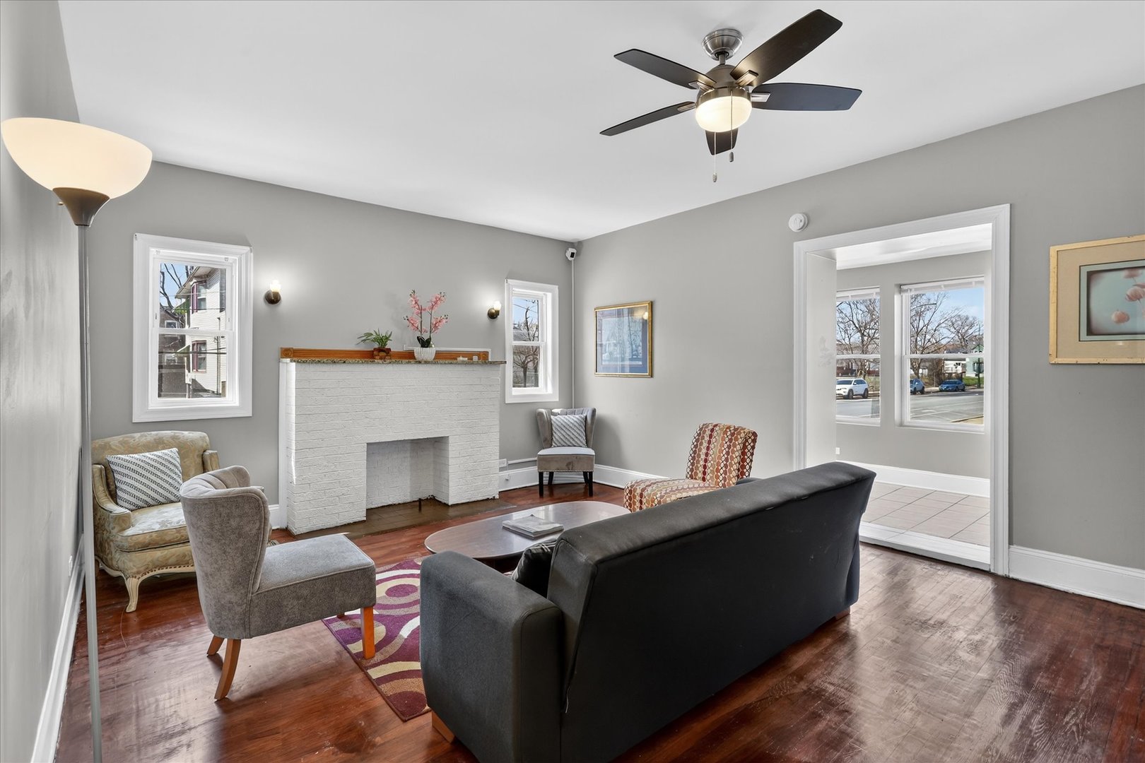 1 East 114th Street Chicago, IL 60628 - Photo 5 of 33 a living room with furniture and a fireplace