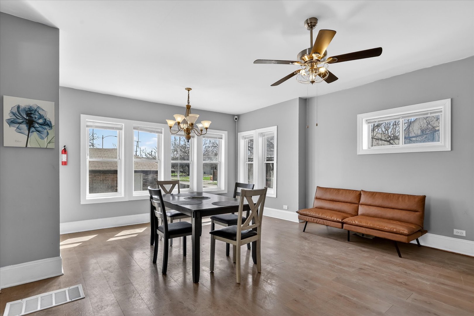 1 East 114th Street Chicago, IL 60628 - Photo 8 of 33 a dining room with furniture window and wooden floor