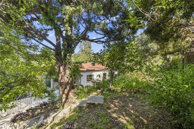 a backyard of a house with lots of green space