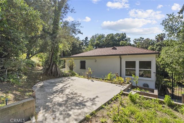 a balcony with view of a garden