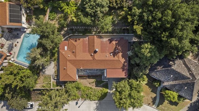 an aerial view of a house with a garden
