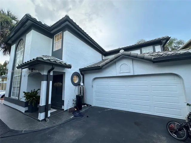 a view of a house with garage