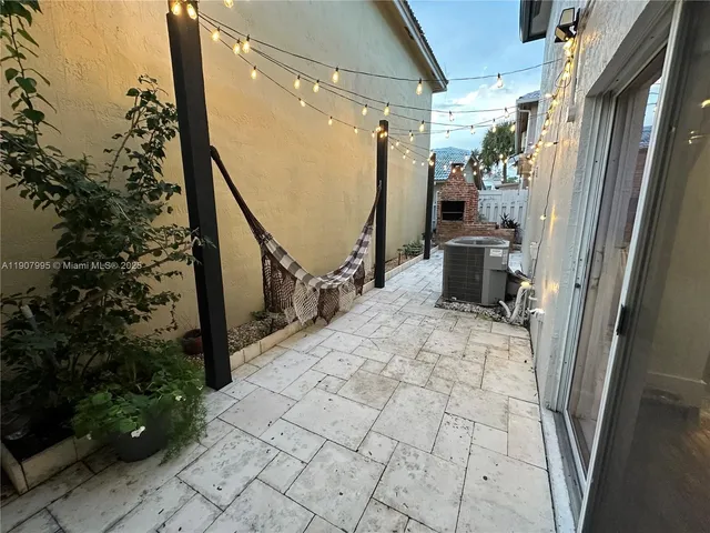 a view of entryway with a door and wooden floor