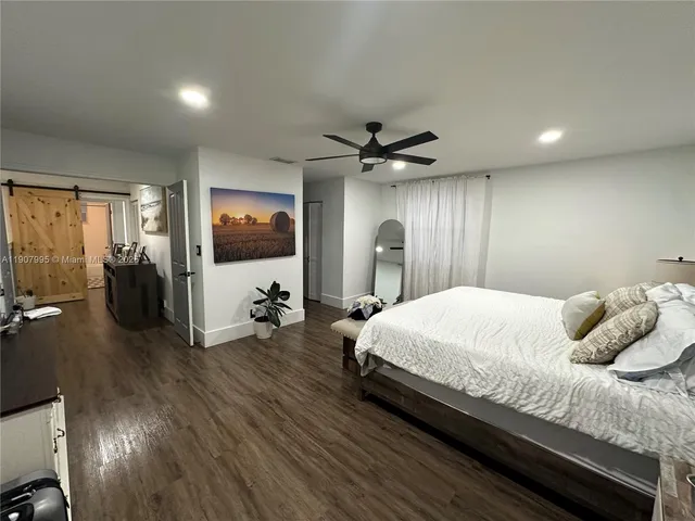 a view of living room with furniture and a fireplace