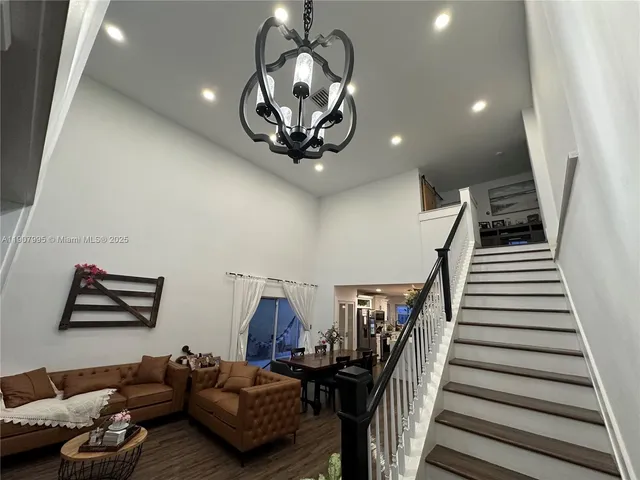 a view of a livingroom with furniture and stairs