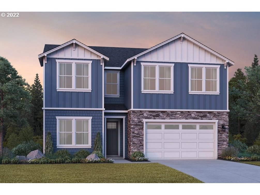 16084 Northwest Ridgeline Street, Unit L 72 Portland, OR 97229 - Photo 1 of 25 a front view of a house with a garden and yard