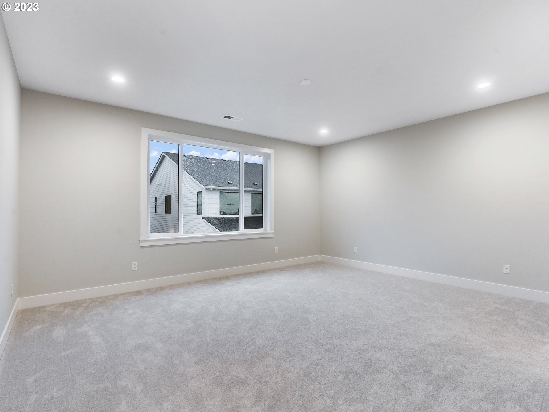 16084 Northwest Ridgeline Street, Unit L 72 Portland, OR 97229 - Photo 14 of 25 a view of an empty room with a window