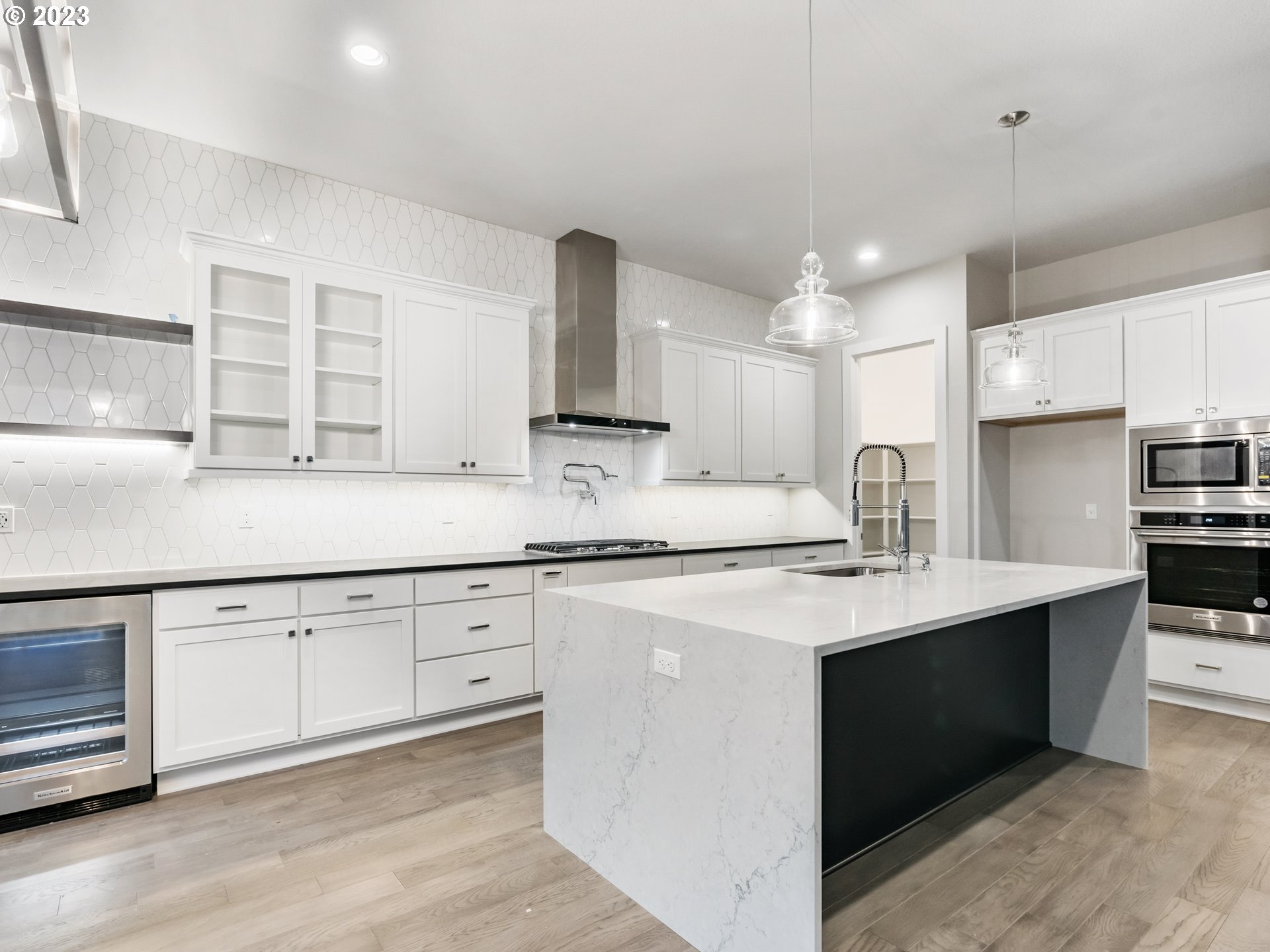 16084 Northwest Ridgeline Street, Unit L 72 Portland, OR 97229 - Photo 2 of 25 a kitchen with stainless steel appliances granite countertop a sink stove and refrigerator