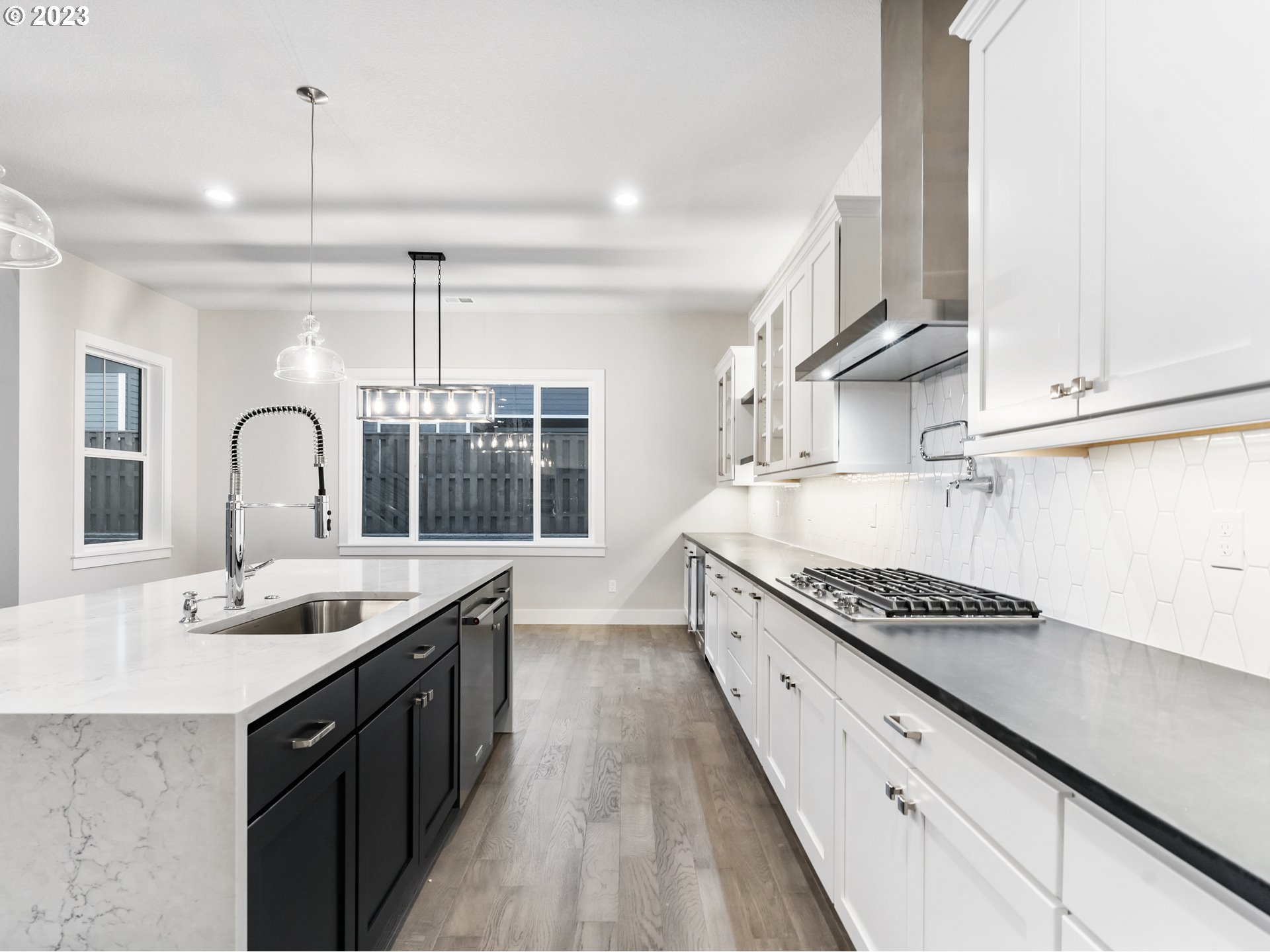 16084 Northwest Ridgeline Street, Unit L 72 Portland, OR 97229 - Photo 4 of 25 a kitchen with stainless steel appliances granite countertop a sink stove and cabinets