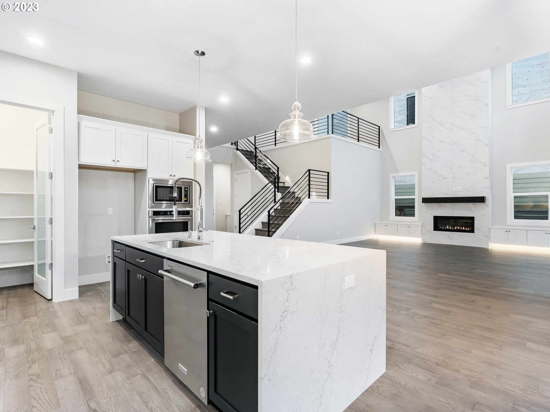16084 Northwest Ridgeline Street, Unit L 72 Portland, OR 97229 - Photo 8 of 25 a open kitchen with stainless steel appliances granite countertop a stove and a refrigerator
