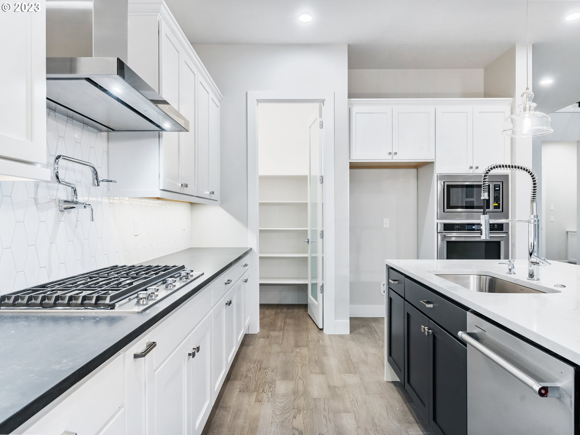 16084 Northwest Ridgeline Street, Unit L 72 Portland, OR 97229 - Photo 9 of 25 a kitchen with a sink stove and cabinets